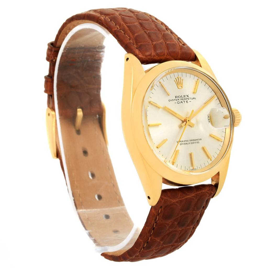 The Rolex Vintage Collection 1500 Men's Yellow Gold Champagne Dial 1500 Men's Yellow Gold Champagne Dial watch is shown at a 3/4 angle, displaying the face, crown, and brown leather strap.