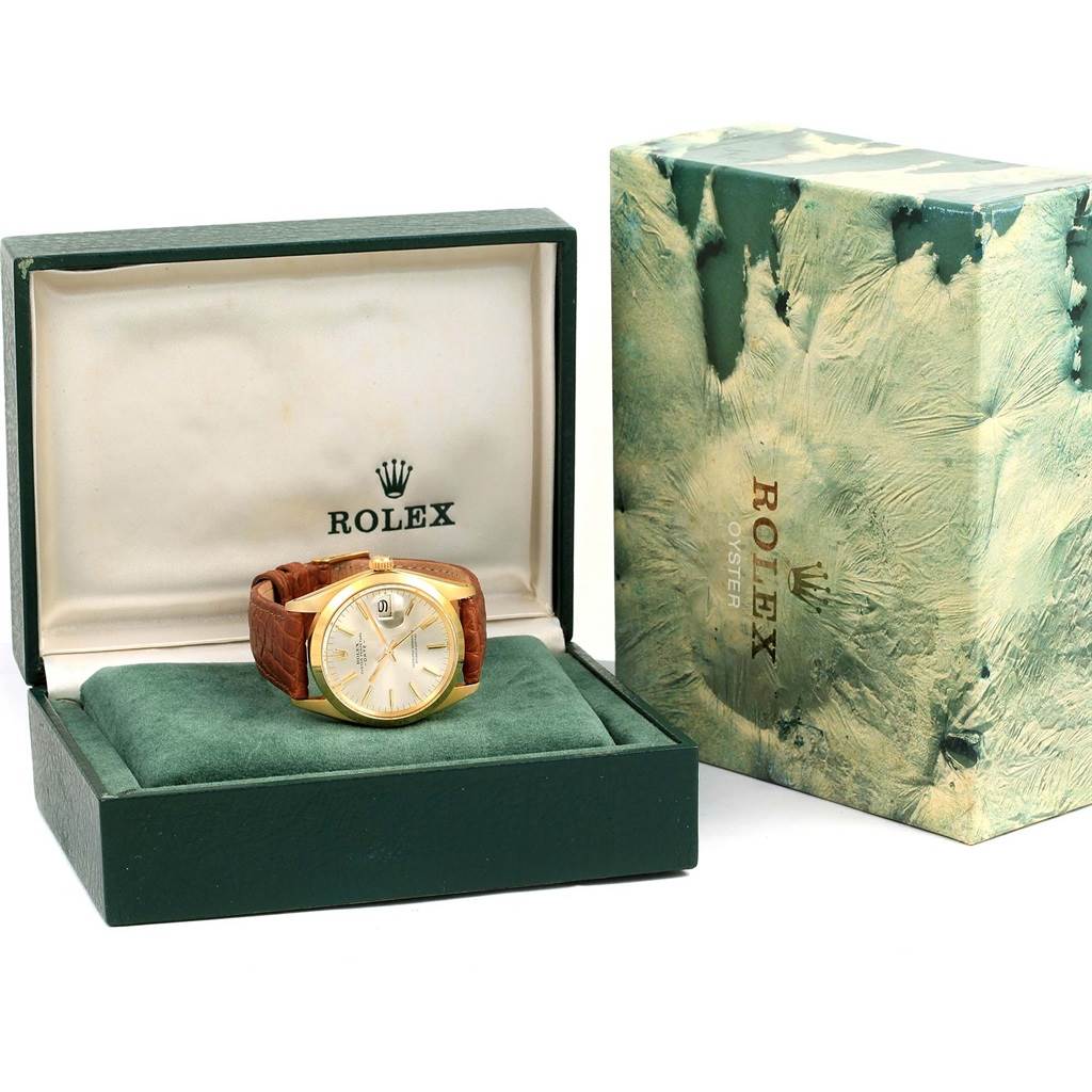 The image shows a Rolex Vintage Collection 1500 Men's Yellow Gold Champagne Dial 1500 Men's Yellow Gold Champagne Dial watch in its open case with an outer box beside it.