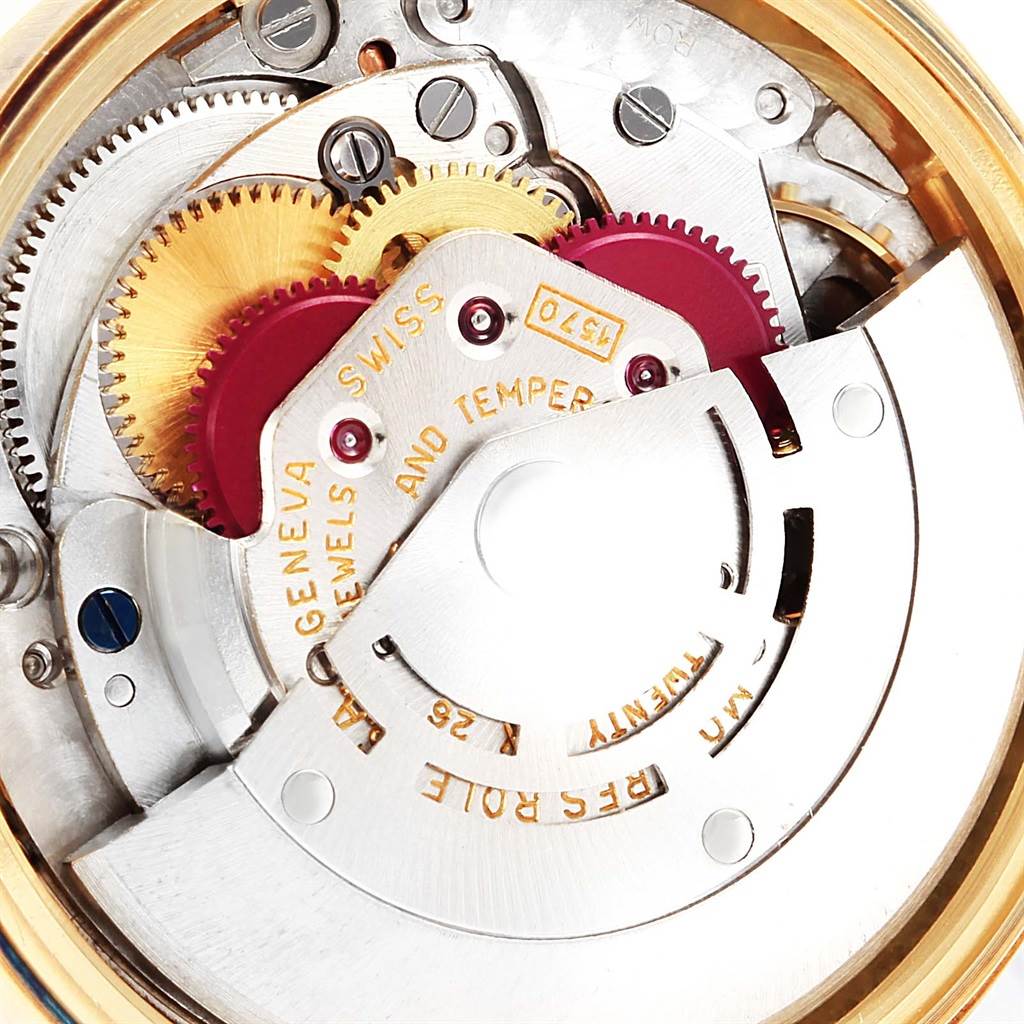 The image shows a close-up view of the internal mechanics of a Vintage Collection Rolex watch.
