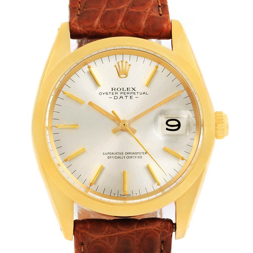 This is a front view of a Rolex Vintage Collection 1500 Men's Yellow Gold Champagne Dial 1500 Men's Yellow Gold Champagne Dial Oyster Perpetual Date watch with a gold case and brown leather strap.