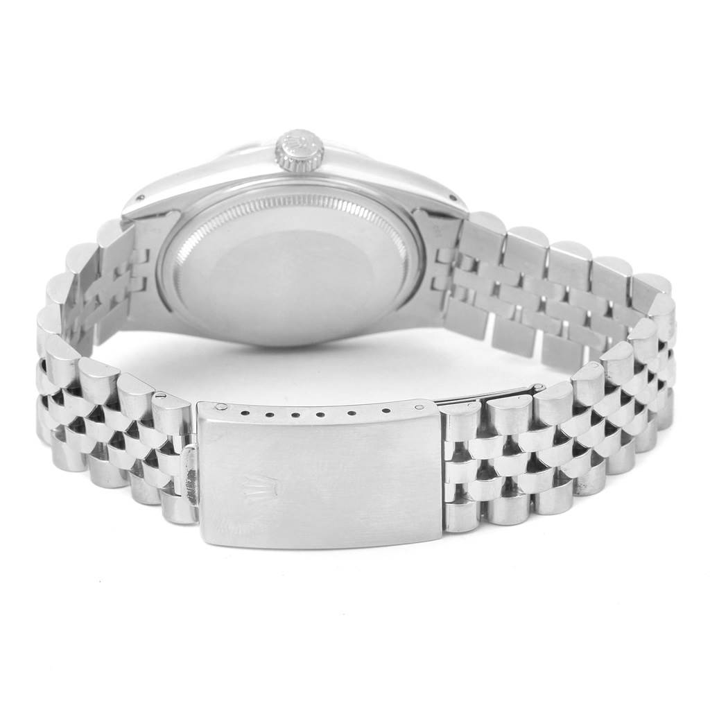 The image shows the backside of a Rolex Vintage Collection 16014 Men's Stainless Steel Silver Dial 16014 Men's Stainless Steel Silver Dial watch, highlighting its case back, bracelet, and clasp.