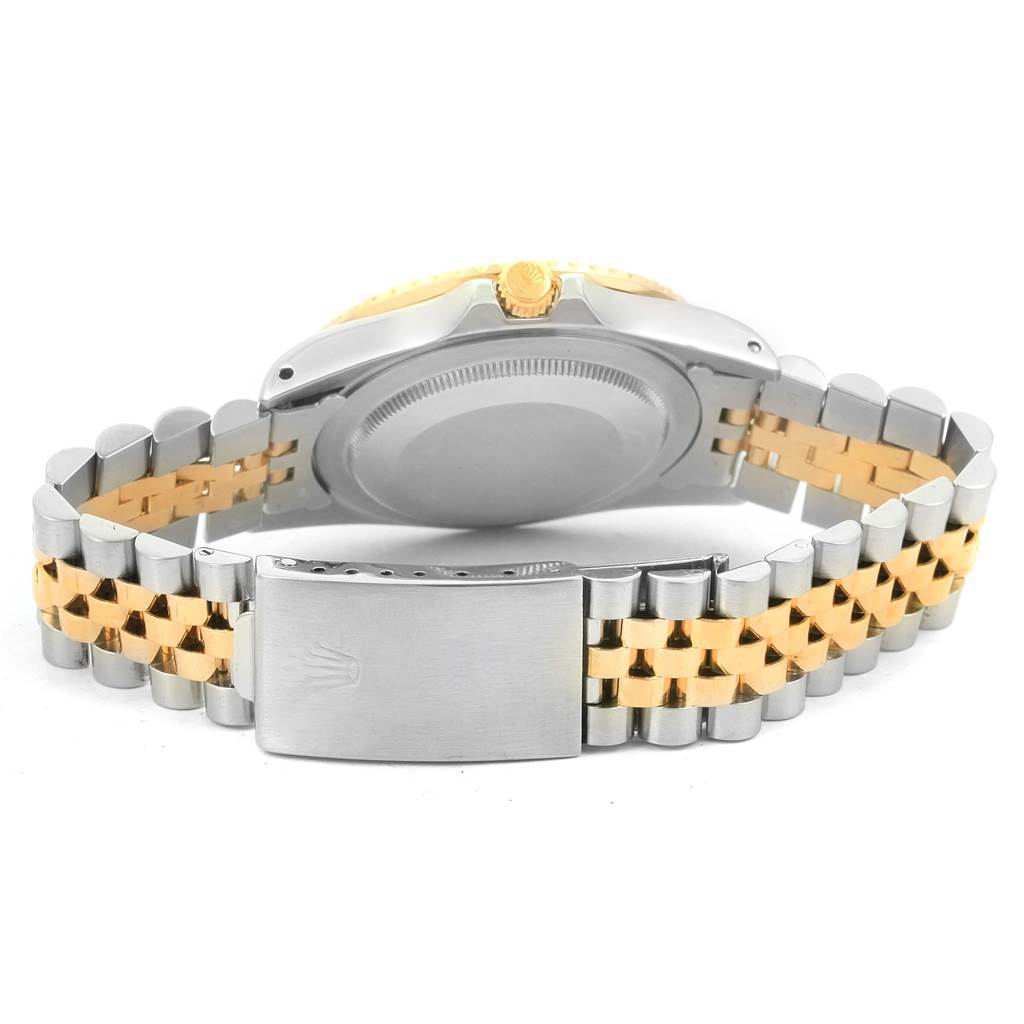 The image shows the back case, crown, and clasp of a Rolex Vintage Collection 16753 Men's Stainless Steel Brown Dial 16753 Men's Stainless Steel Brown Dial watch.