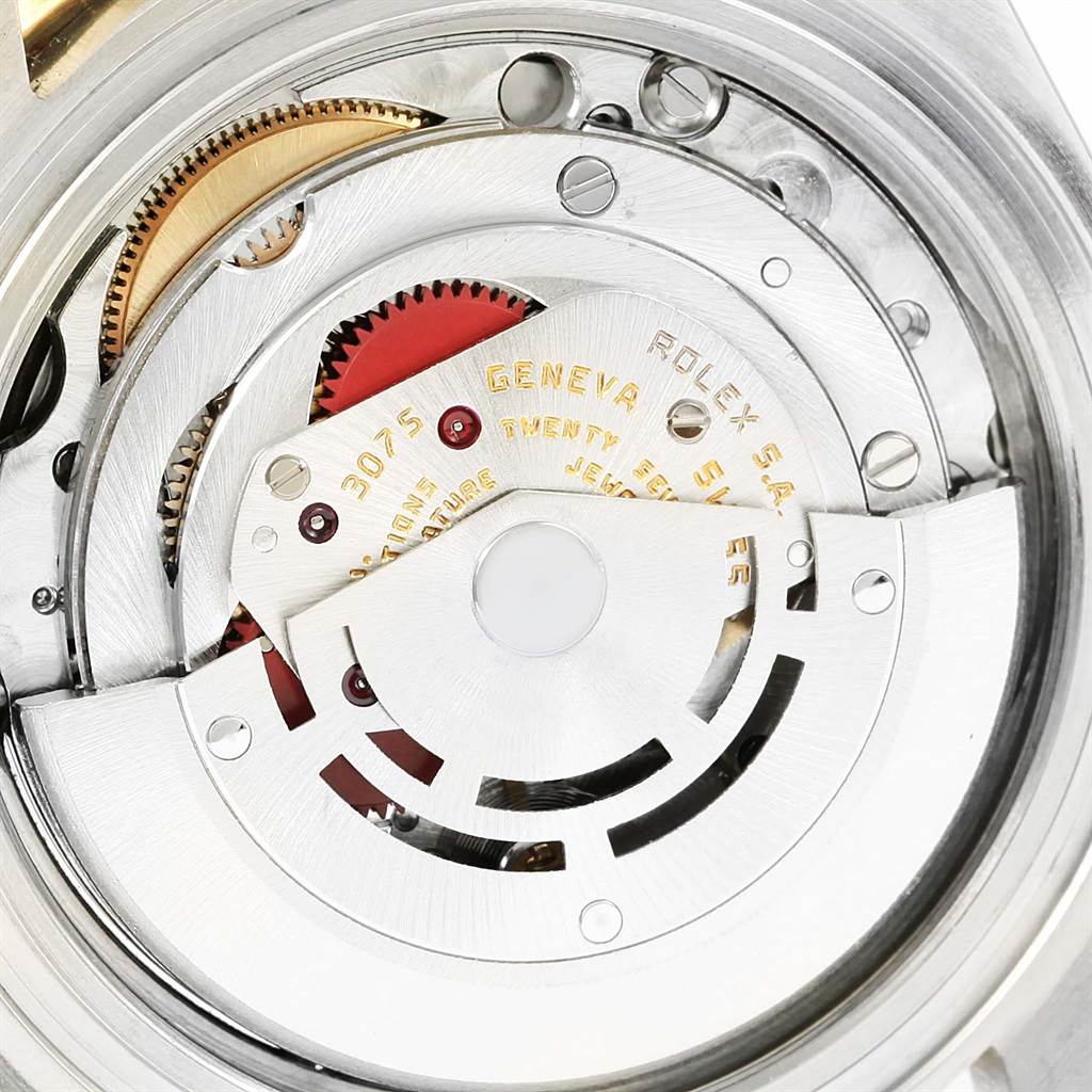The image shows the intricate internal mechanism of a Vintage Collection Rolex watch from a top-down angle.