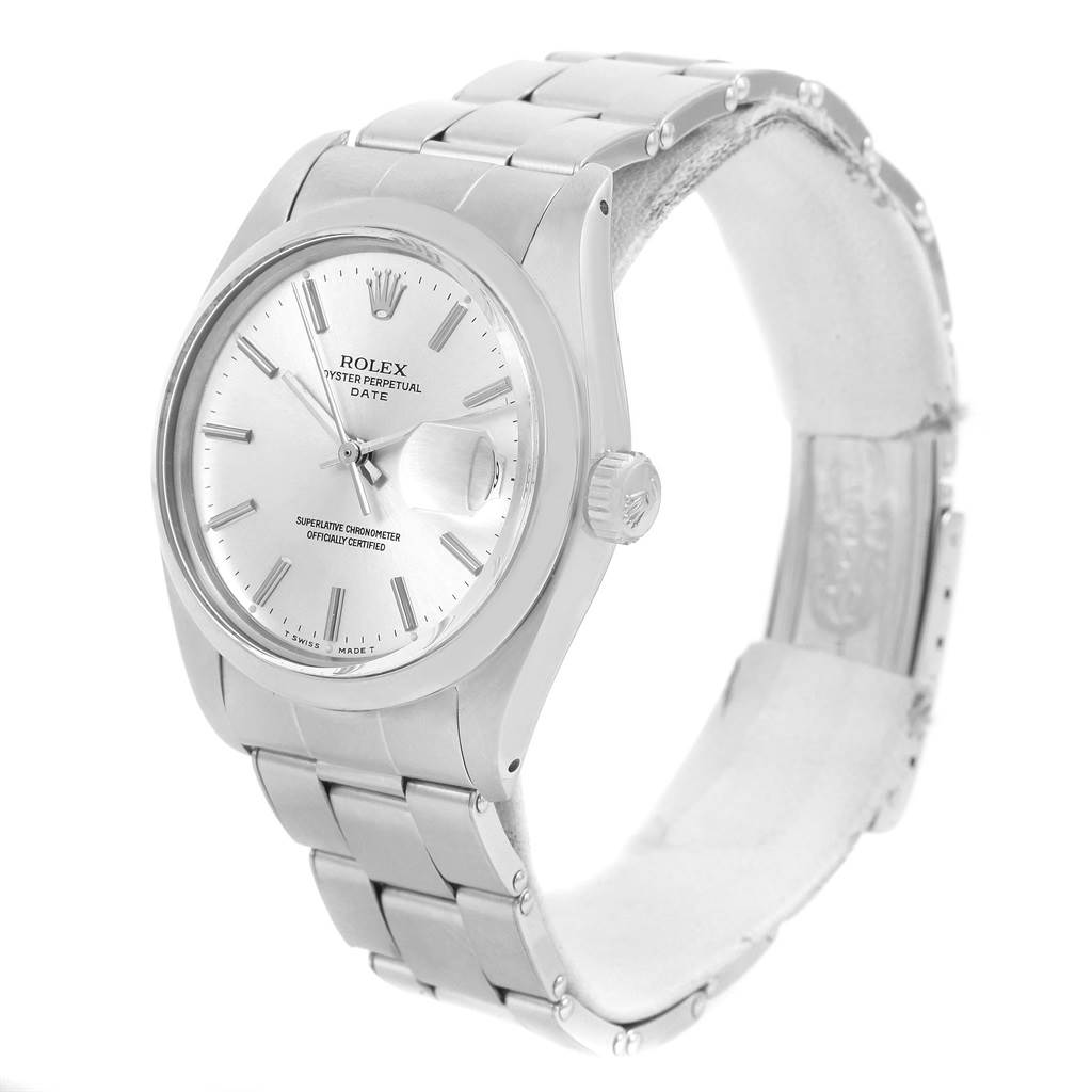 The image shows a Vintage Collection Rolex Oyster Perpetual Date watch at a three-quarter angle, highlighting the face, crown, and bracelet.