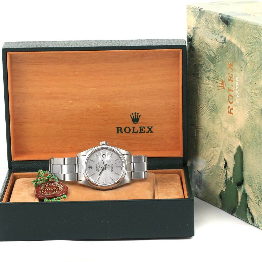 The image shows a Vintage Collection Rolex watch, front-facing, in its open box with the brand's logo visible.