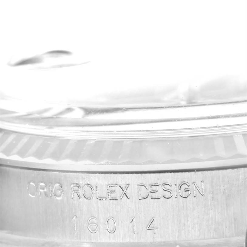 This image shows a close-up of the bezel and engraved model information on the Rolex Vintage Collection 16014 Men's Stainless Steel Silver Dial 16014 Men's Stainless Steel Silver Dial watch.