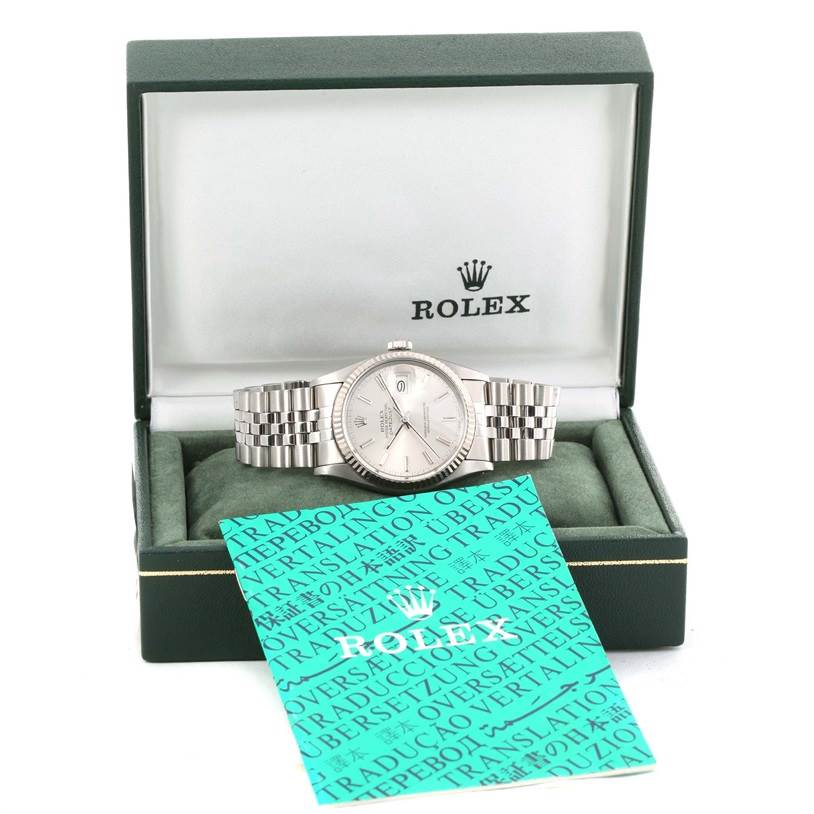 The image shows a Rolex Vintage Collection 16014 Men's Stainless Steel Silver Dial 16014 Men's Stainless Steel Silver Dial watch at a straight angle inside its open box, along with accompanying documents.