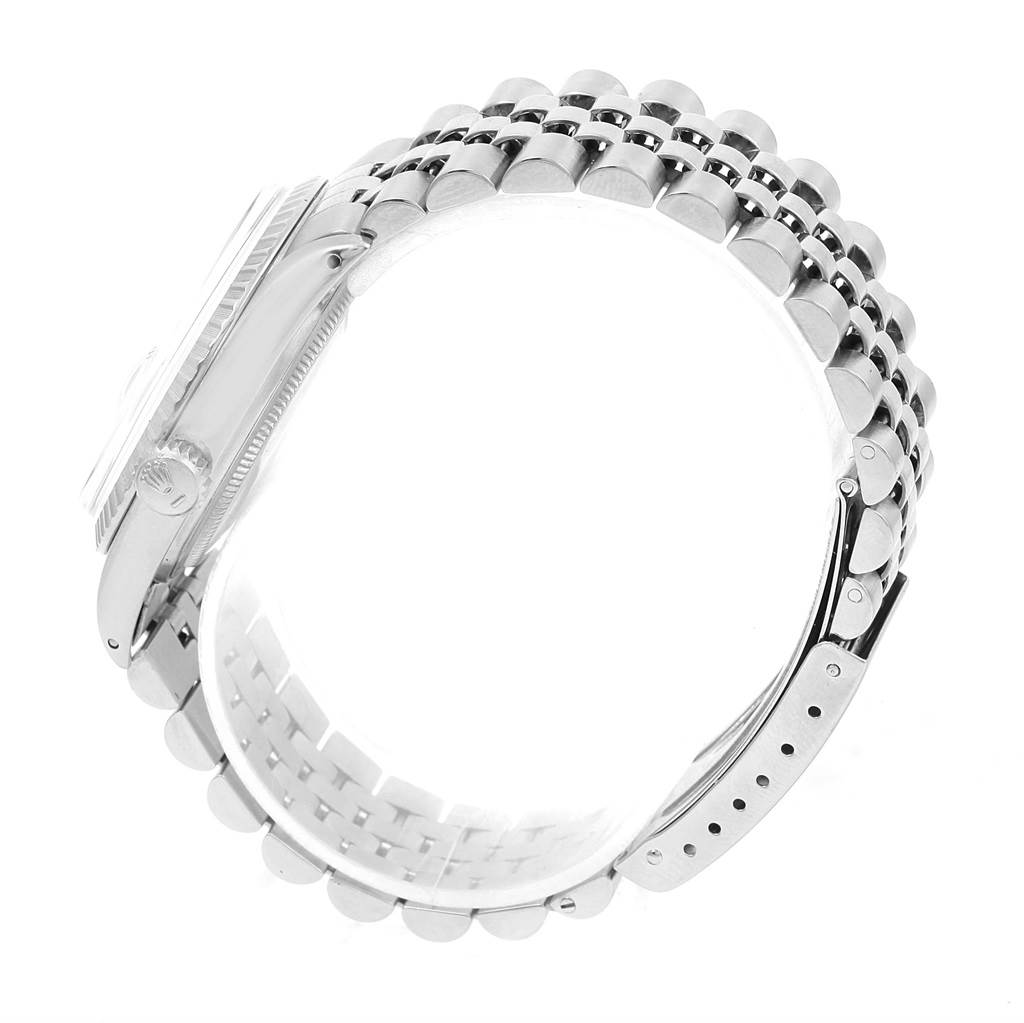 The image shows a side angle of the Rolex Vintage Collection 1603 Men's Stainless Steel White Dial 1603 Men's Stainless Steel White Dial model watch, highlighting its case, crown, and bracelet.