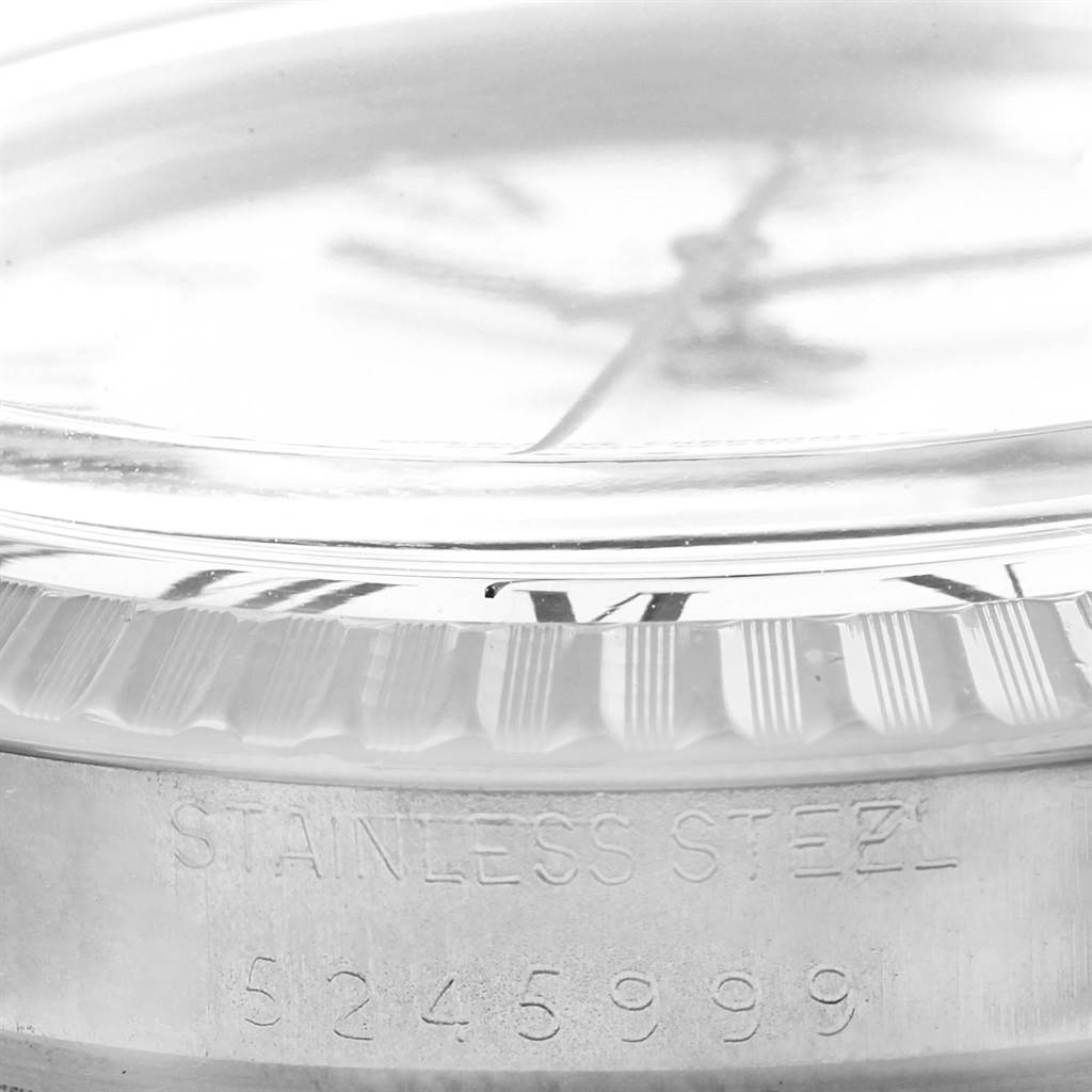 The image shows a close-up side angle of the case and the bezel of a Rolex Vintage Collection 1603 Men's Stainless Steel White Dial 1603 Men's Stainless Steel White Dial model, with the serial number visible.