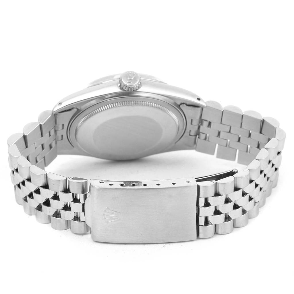 This image shows the back of the Vintage Collection Rolex watch, highlighting the case back, crown, and stainless steel bracelet with clasp.