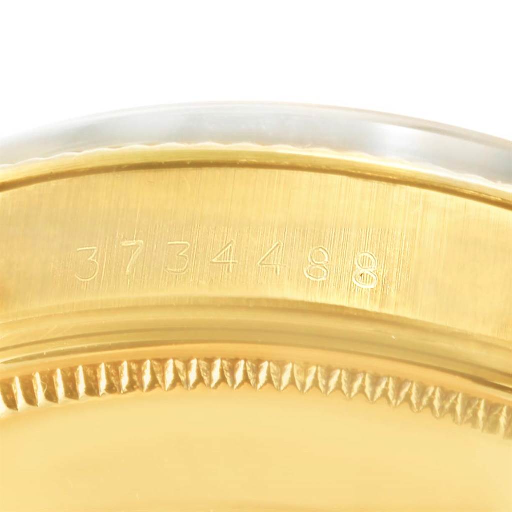 This image shows a close-up of the serial number on the edge of the case back of a Rolex Vintage Collection 1503 Men's Yellow Gold Champagne Dial 1503 Men's Yellow Gold Champagne Dial watch.