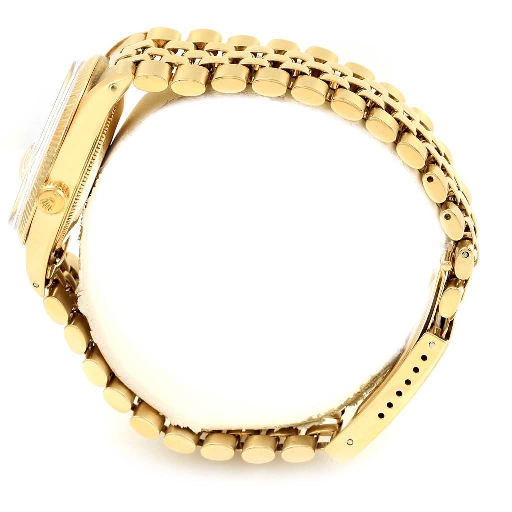 The image shows a side view of a Vintage Collection model Rolex watch, highlighting the gold case and bracelet.