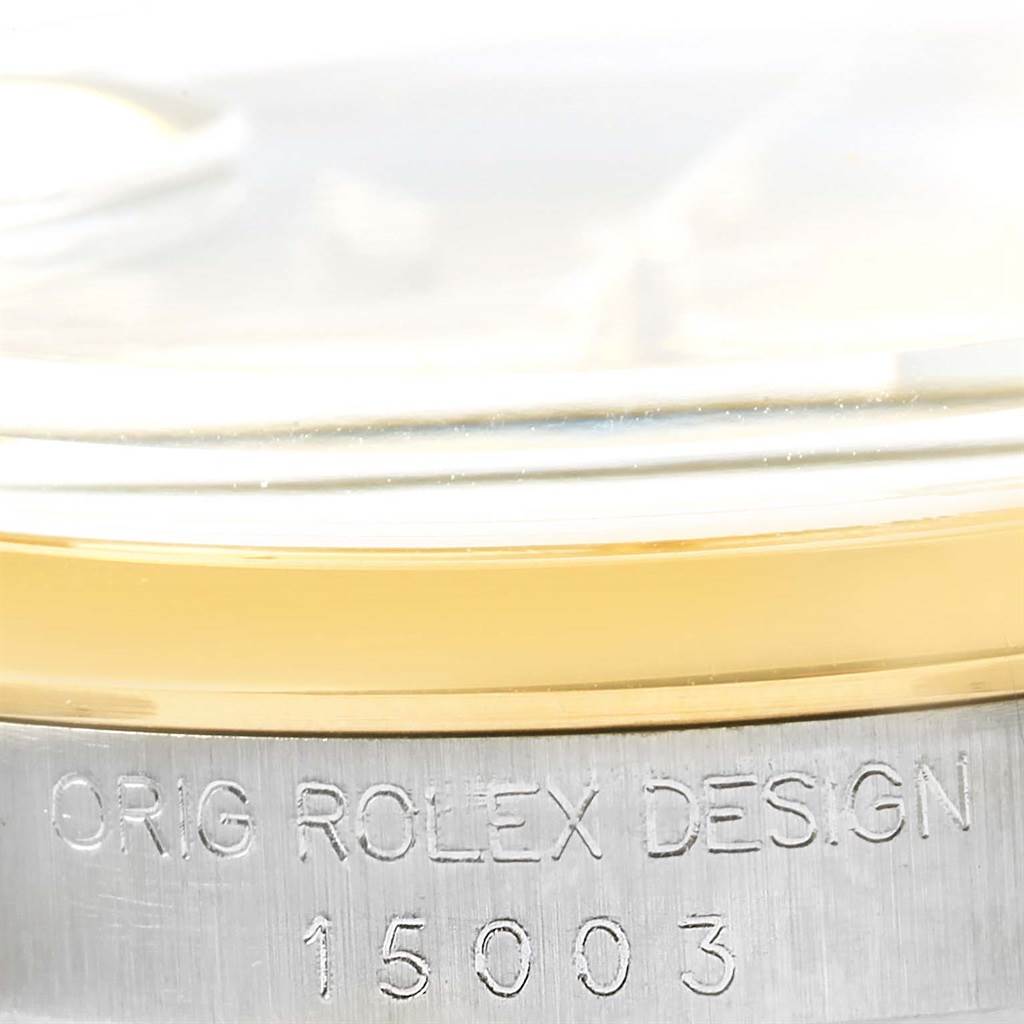 The image shows a close-up view of the side, specifically the bezel and case, of the Vintage Collection model by Rolex, along with its engraving.