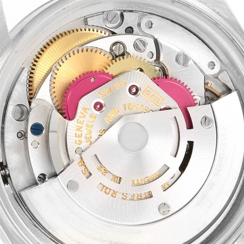 This image shows the internal mechanism of a Rolex Vintage Collection 1603 Men's Stainless Steel Blue Dial 1603 Men's Stainless Steel Blue Dial watch, including gears and the movement parts.
