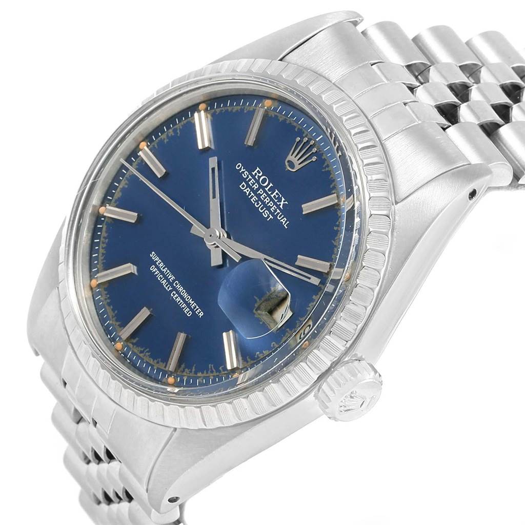The image shows a side-angle view of the Vintage Collection Rolex Datejust, highlighting the blue dial, fluted bezel, and Jubilee bracelet.
