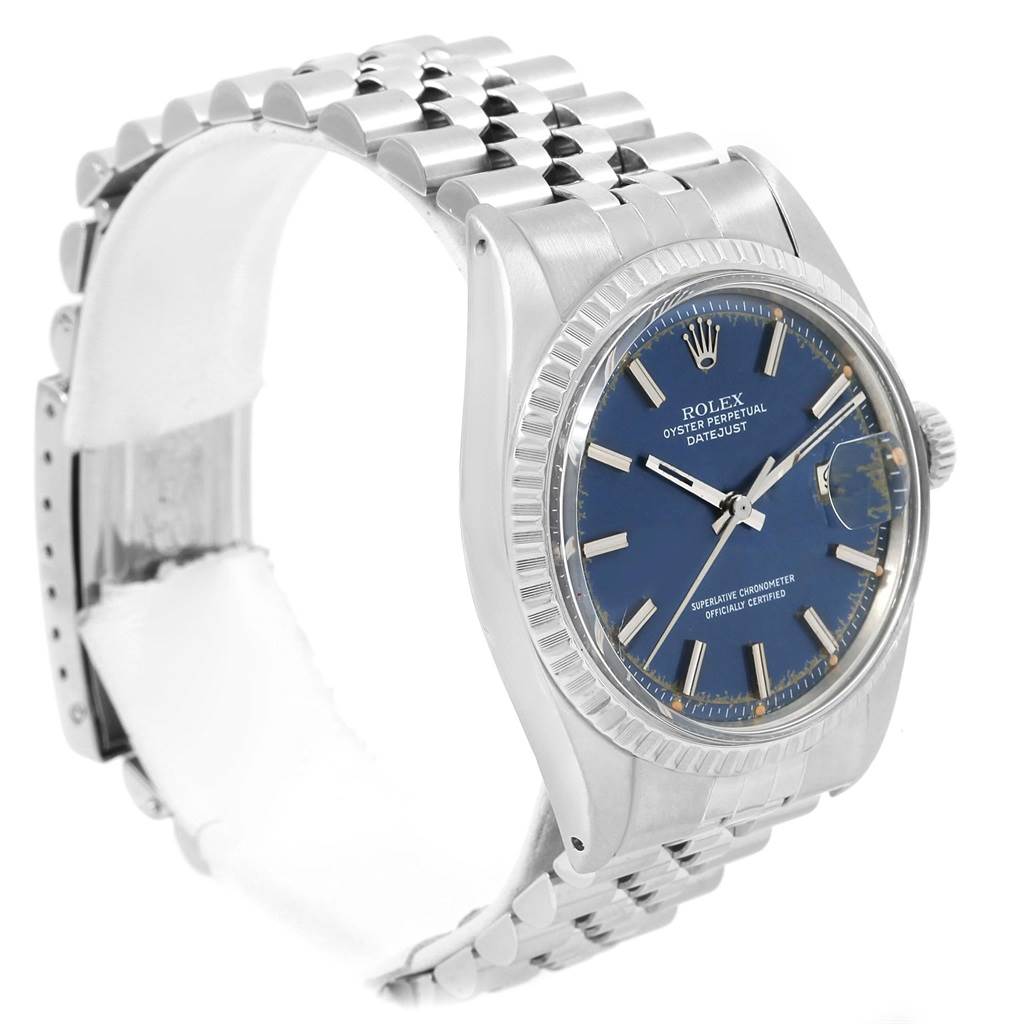 The image shows a side-angle view of a Rolex Vintage Collection 1603 Men's Stainless Steel Blue Dial 1603 Men's Stainless Steel Blue Dial watch, highlighting its face, bezel, crown, and Jubilee bracelet.