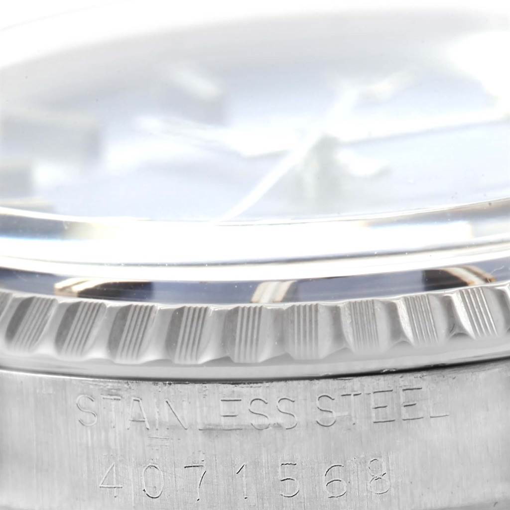 The image shows a close-up of the side view of the bezel and case edge of a Rolex Vintage Collection 1603 Men's Stainless Steel Blue Dial 1603 Men's Stainless Steel Blue Dial model watch.