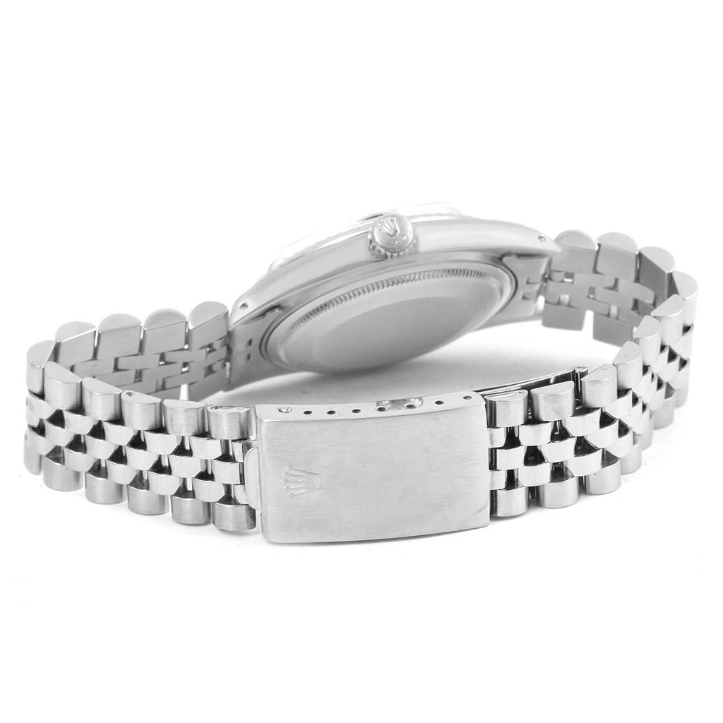 The image shows the back of a Rolex Vintage Collection 1603 Men's Stainless Steel Blue Dial 1603 Men's Stainless Steel Blue Dial watch, highlighting its clasp and part of the bracelet.