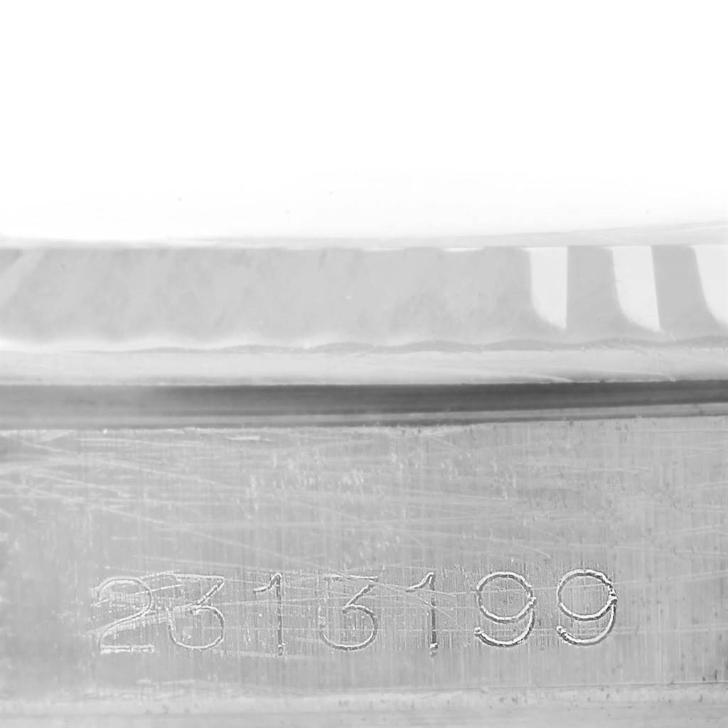 This image shows a close-up of the serial number engraving on the case of a Rolex Vintage Collection 1603 Stainless Steel Silver Dial 1603 Stainless Steel Silver Dial watch.