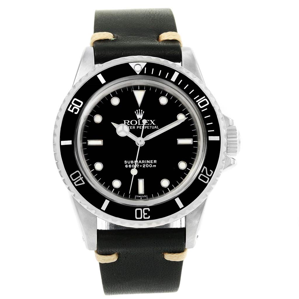 The image shows a front view of a Vintage Collection Rolex Submariner watch with a black dial and leather strap.