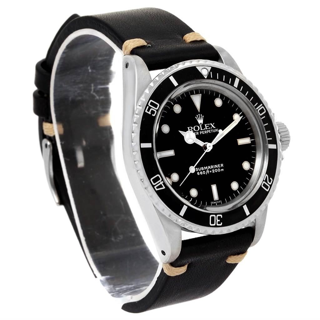 The image shows a side-angle view of a Rolex Vintage Collection 5513 Men's Stainless Steel Black Dial 5513 Men's Stainless Steel Black Dial Submariner watch, highlighting the dial, bezel, and strap.