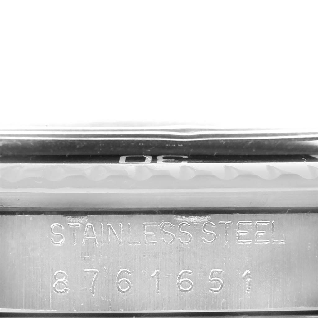 This image shows a close-up side view of the stainless steel casing and engraved serial number of the Rolex Vintage Collection 5513 Men's Stainless Steel Black Dial 5513 Men's Stainless Steel Black Dial watch.