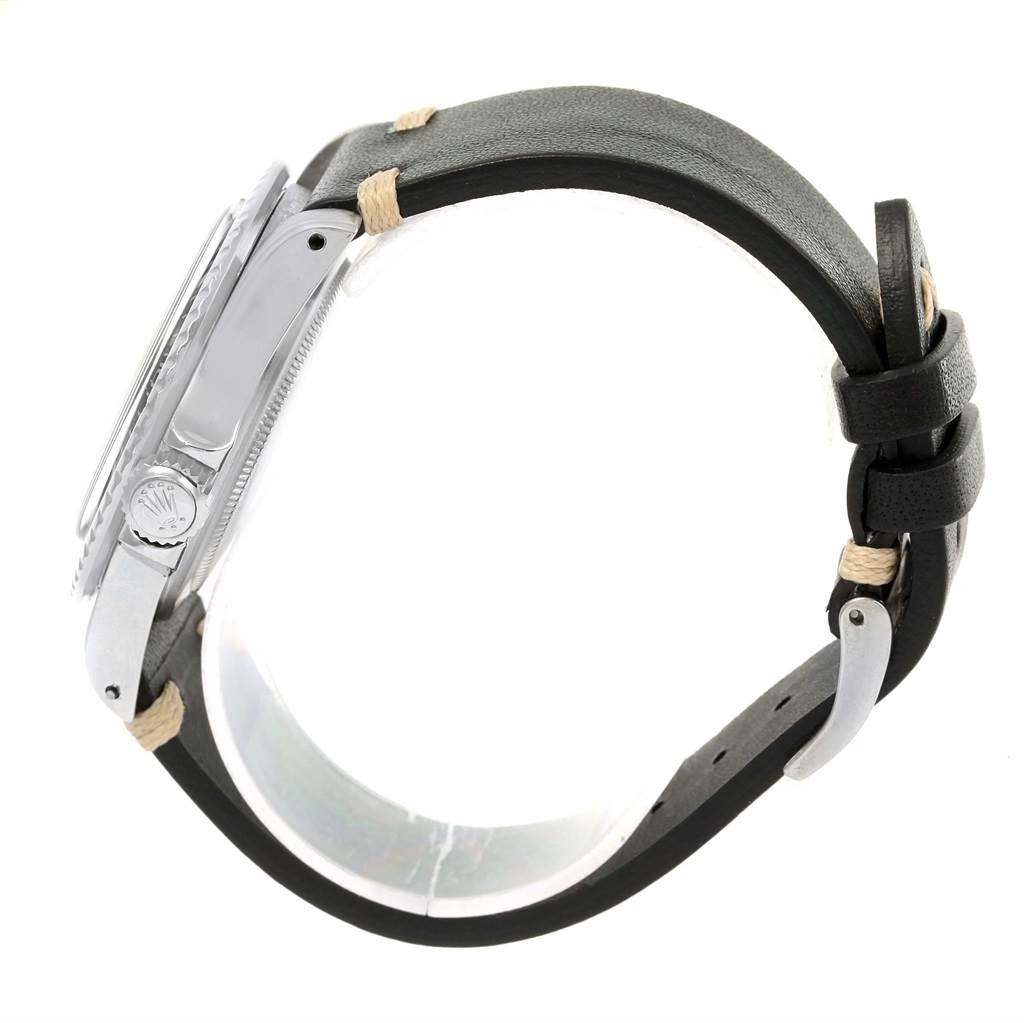 The Rolex Vintage Collection 5513 Men's Stainless Steel Black Dial 5513 Men's Stainless Steel Black Dial watch is shown from the side, highlighting its case, crown, and leather strap.