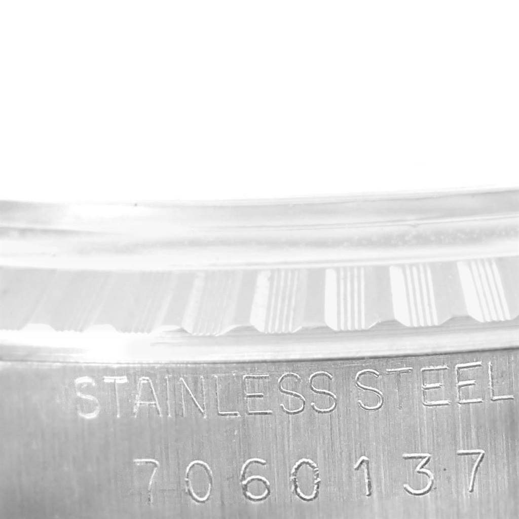 This close-up image shows the engraved stainless steel case back of a Rolex Vintage Collection 16030 Men's Stainless Steel Silver Dial 16030 Men's Stainless Steel Silver Dial model watch.