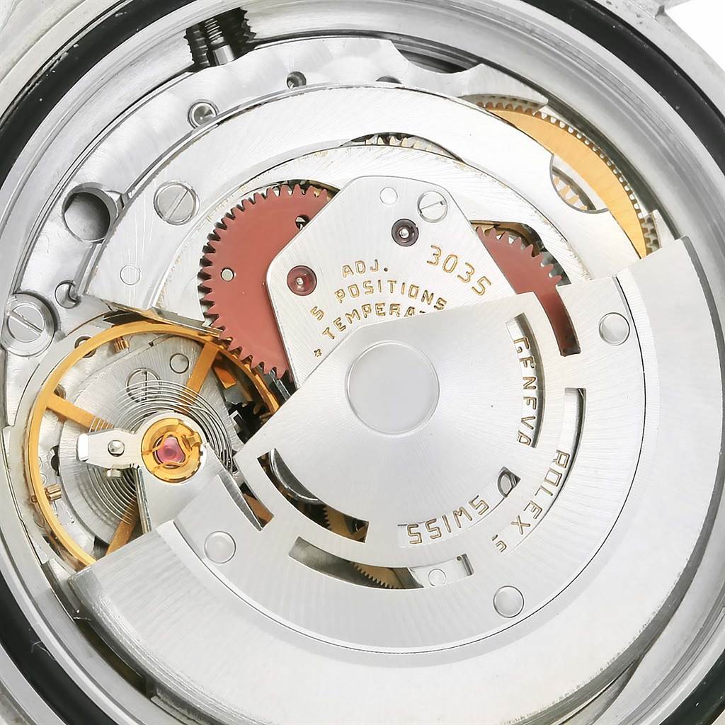This close-up shows the intricate internal mechanics and movement of a Vintage Collection Rolex watch.