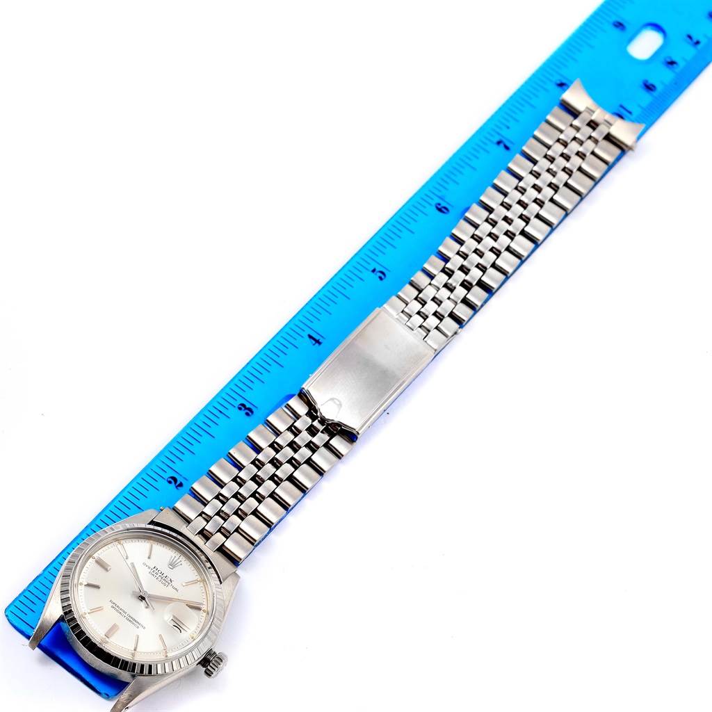 The image shows a Vintage Collection Rolex watch laid flat, with the face, bracelet, and clasp visible, measured against a blue ruler.