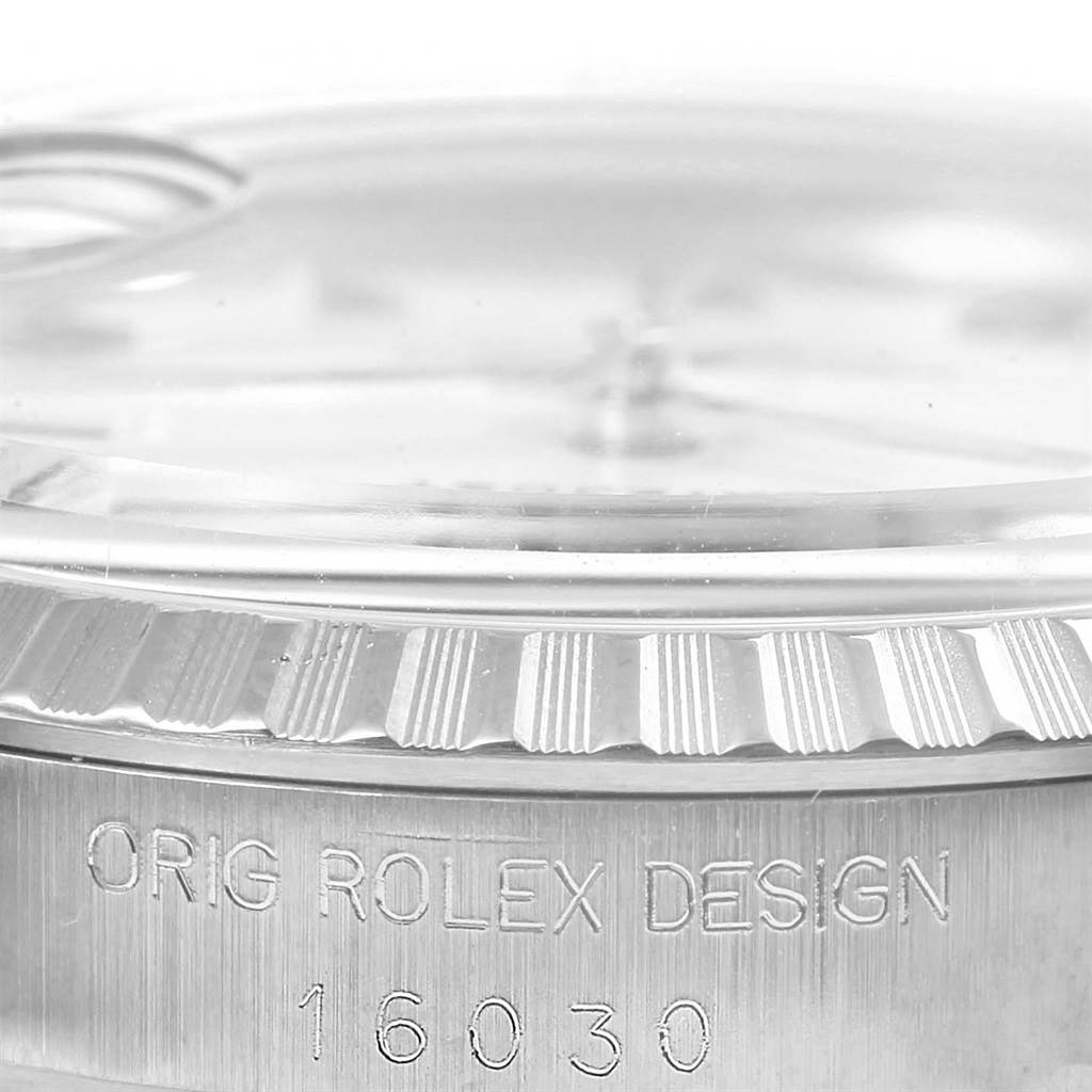 The image shows a close-up of the bezel and the engraved serial/model number of a Rolex Vintage Collection 16030 Men's Stainless Steel Silver Dial 16030 Men's Stainless Steel Silver Dial watch.