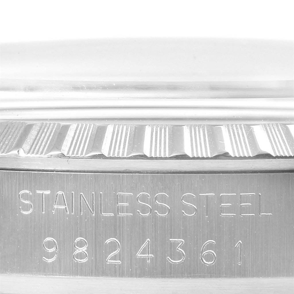 This image shows a close-up view of the side of the case of the Rolex Vintage Collection 16030 Men's Stainless Steel Silver Dial 16030 Men's Stainless Steel Silver Dial watch, focusing on the stainless steel material and serial number.