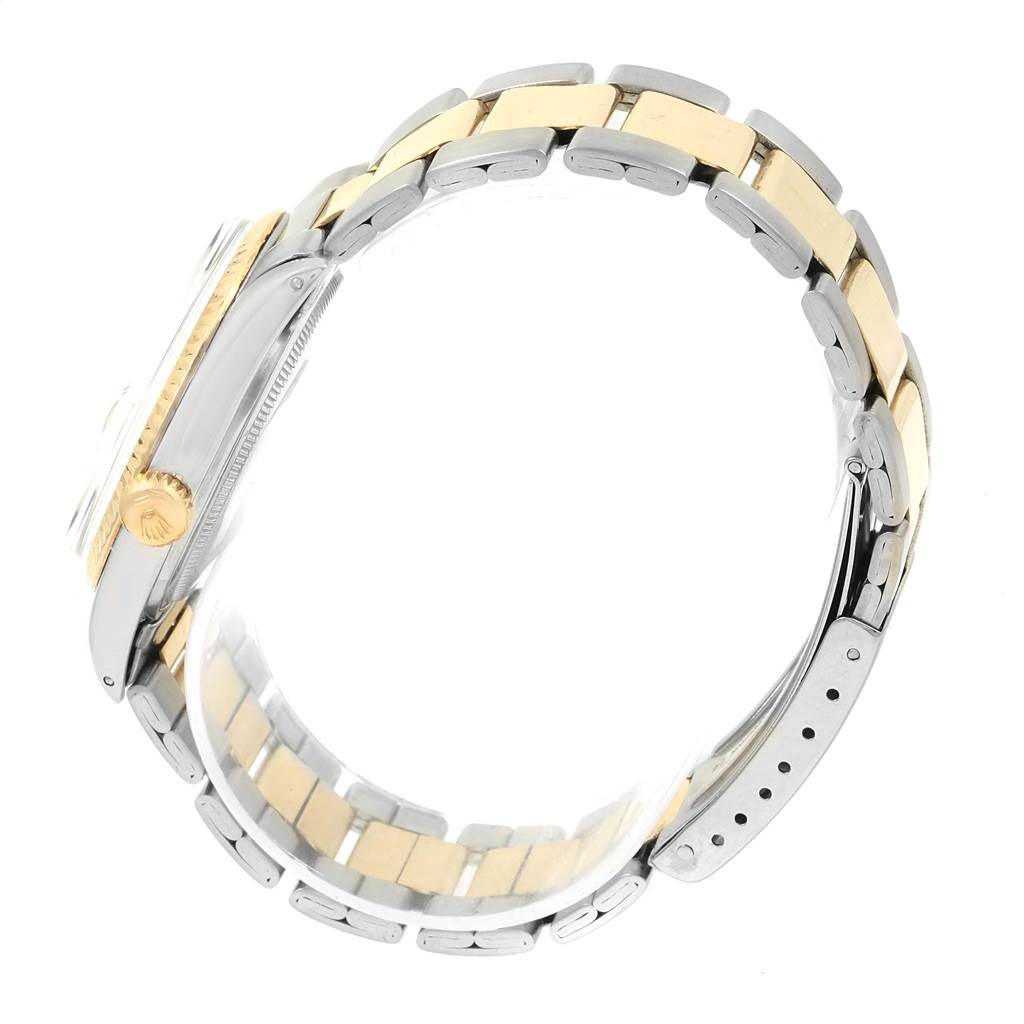 This side view of the Rolex Vintage Collection 1601 Men's Stainless Steel Silver Dial 1601 Men's Stainless Steel Silver Dial model showcases its two-tone bracelet and crown.