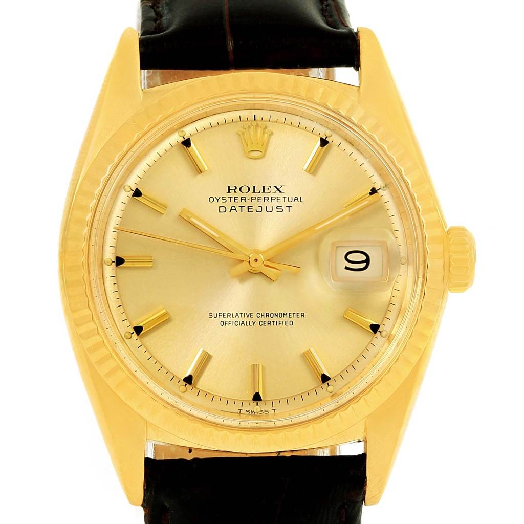 The image shows a frontal view of the Rolex Vintage Collection 1601 Men's Yellow Gold Champagne Dial 1601 Men's Yellow Gold Champagne Dial Datejust watch, displaying its face, hands, crown, and part of the strap.