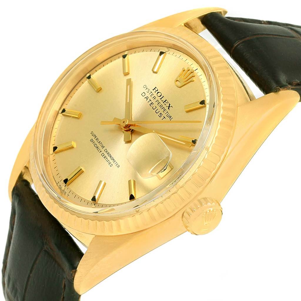 The image shows a side-angled view of the Rolex Vintage Collection 1601 Men's Yellow Gold Champagne Dial 1601 Men's Yellow Gold Champagne Dial Datejust watch, highlighting its gold dial, crown, and leather strap.