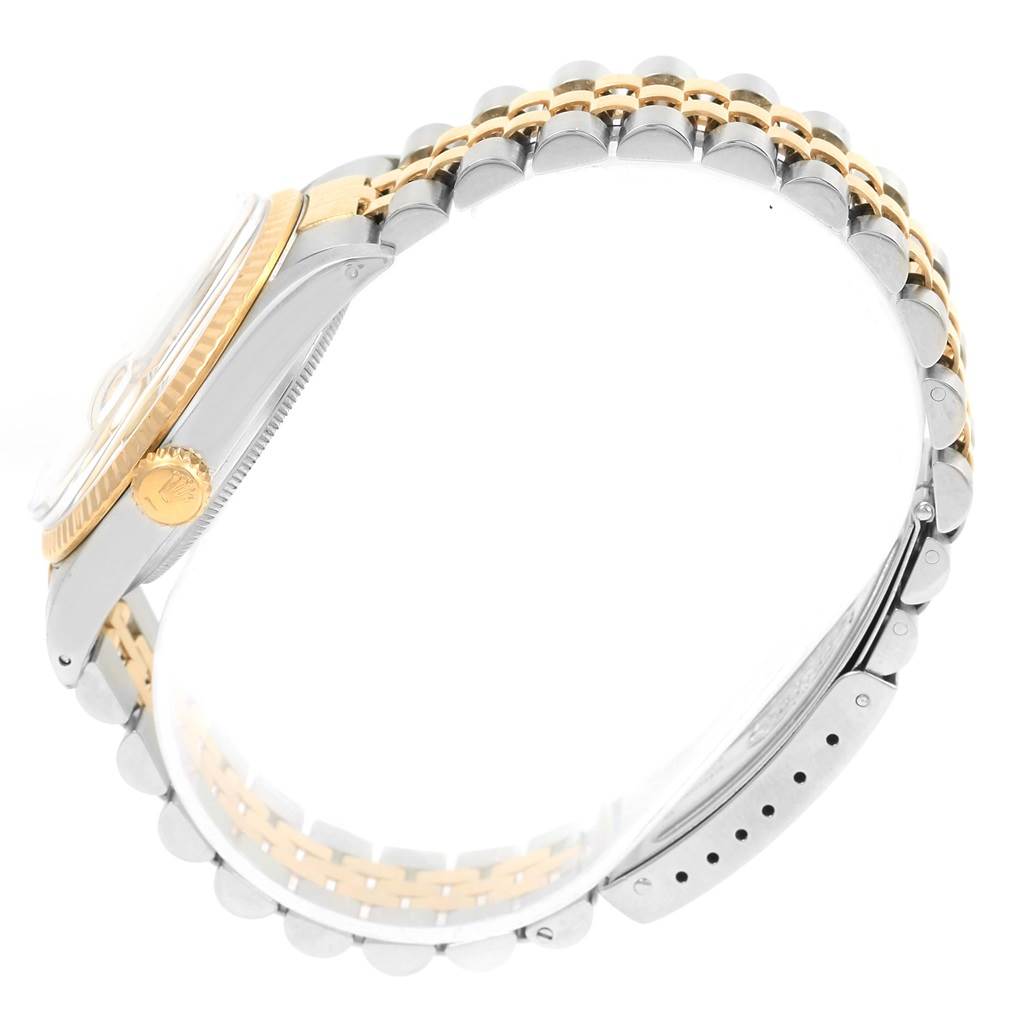 The Rolex Vintage Collection 16013 Men's Stainless Steel Champagne Dial 16013 Men's Stainless Steel Champagne Dial watch is shown from a side angle, highlighting the case, crown, and metal bracelet.