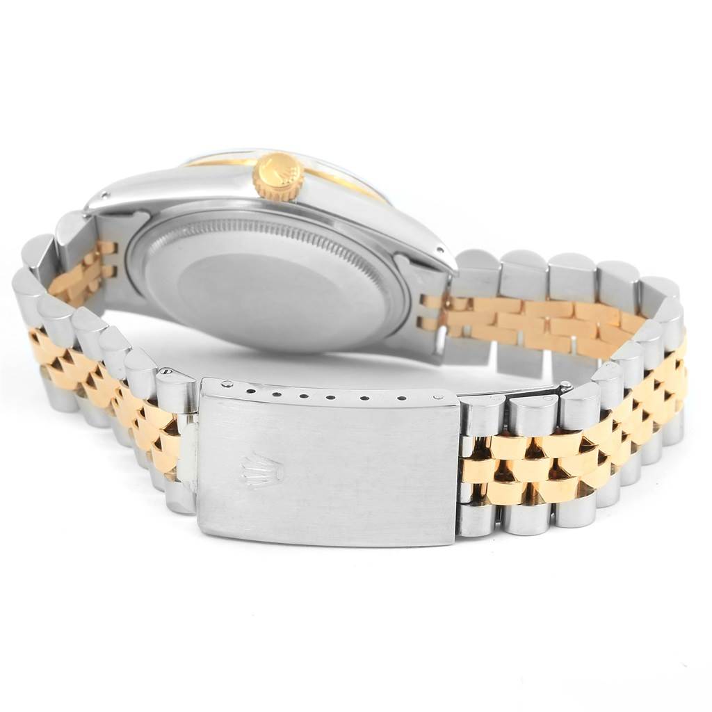 The image shows a rear view of the Rolex Vintage Collection 16013 Men's Stainless Steel Champagne Dial 16013 Men's Stainless Steel Champagne Dial watch, highlighting its two-tone metal bracelet and clasp.