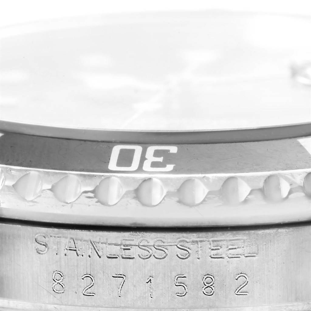 This image shows a close-up of the bezel and casing of the Rolex Vintage Collection 16800 Men's Stainless Steel Black Dial 16800 Men's Stainless Steel Black Dial watch, including the "30" marker and serial number.