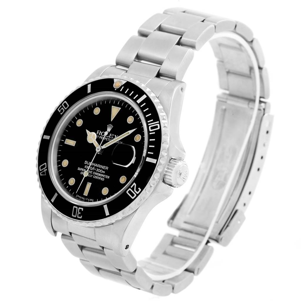 This image shows a Rolex Submariner from the Vintage Collection at an angled view, highlighting the dial, bezel, crown, and stainless steel bracelet.