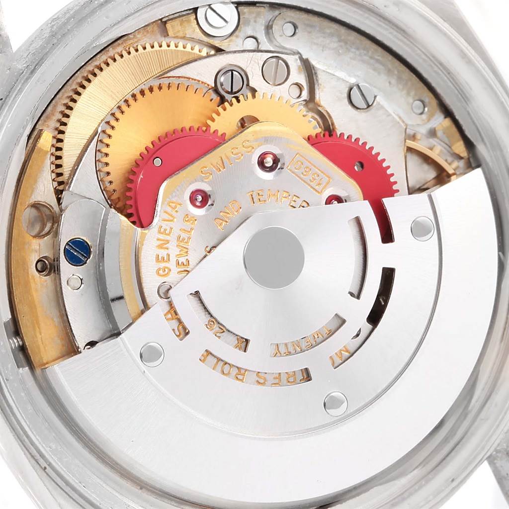 The image shows the intricate inner mechanism and gears of a Rolex Vintage Collection 16014 Men's Stainless Steel Silver Dial 16014 Men's Stainless Steel Silver Dial model watch.