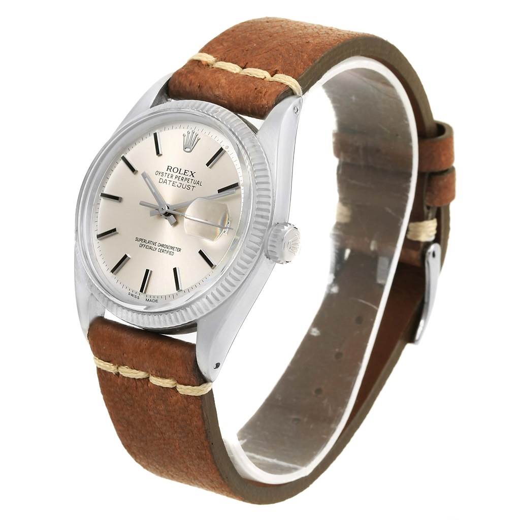 The Rolex Vintage Collection 16014 Men's Stainless Steel Silver Dial 16014 Men's Stainless Steel Silver Dial Datejust is shown at an angle highlighting the dial, leather strap, and fluted bezel.