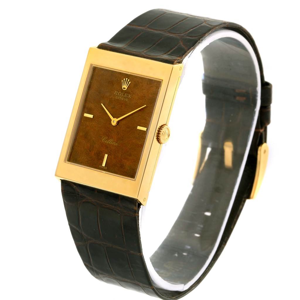 This image shows a Rolex Vintage Collection 5071 Men's Yellow Gold Brown Dial 5071 Men's Yellow Gold Brown Dial watch from a front-side angle, highlighting its rectangular face and leather strap.