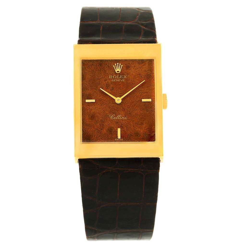 This image shows a frontal view of the Vintage Collection Rolex Cellini watch with a gold rectangular case and a dark leather strap.