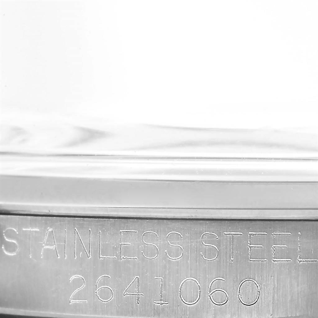 This image shows a close-up of the side case of the Rolex Vintage Collection 6426 Men's Stainless Steel Silver Dial 6426 Men's Stainless Steel Silver Dial watch, highlighting the stainless steel engraving and serial number.