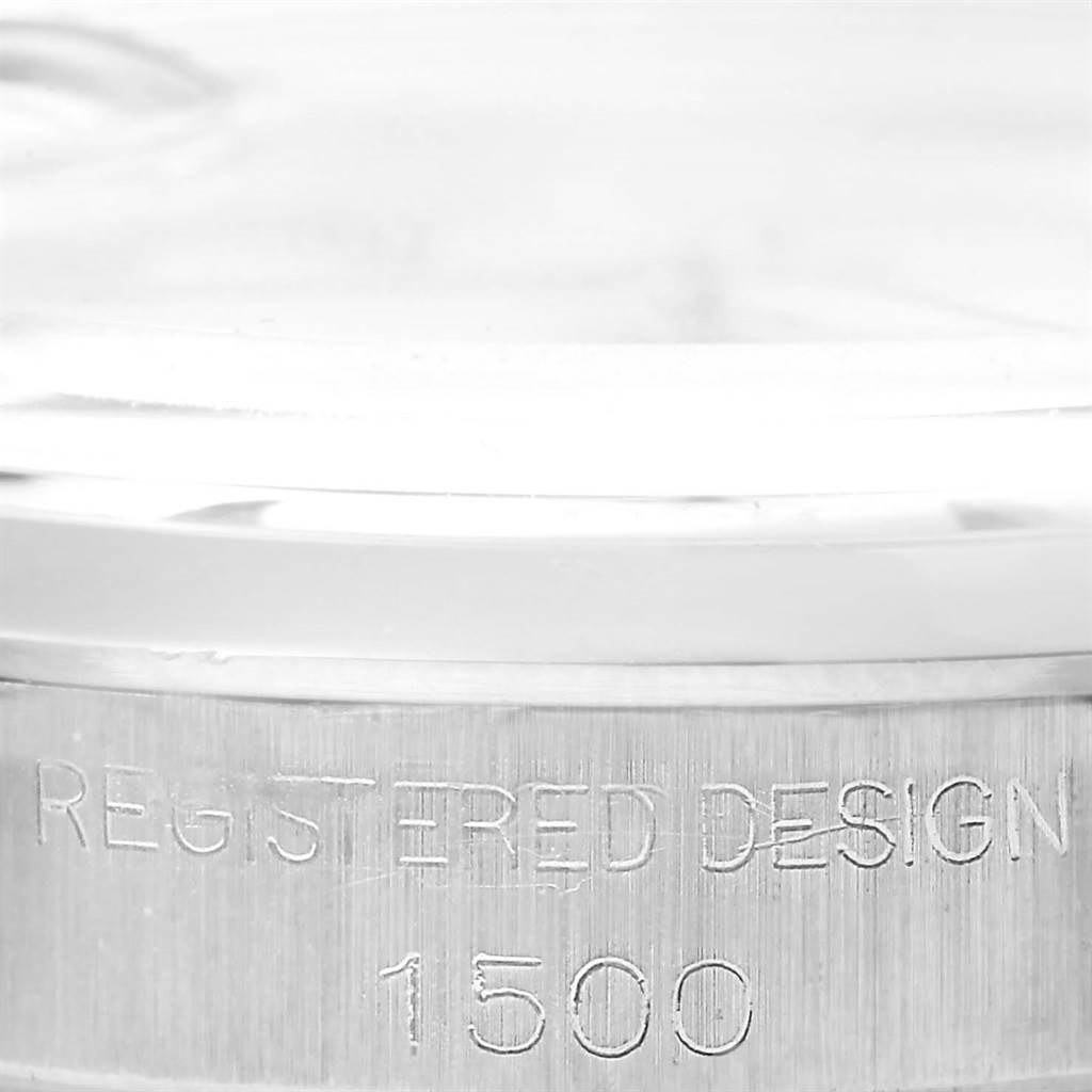This close-up image shows the serial number and part of the case of the Rolex Vintage Collection 1500 Men's Stainless Steel Silver Dial 1500 Men's Stainless Steel Silver Dial model watch.