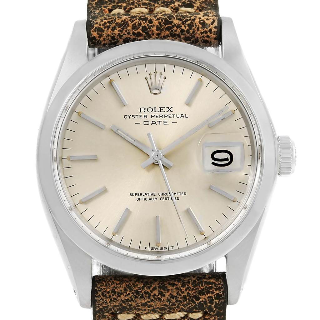 The image shows a frontal view of a Rolex Oyster Perpetual Date Vintage Collection watch with a beige dial and a textured leather strap.