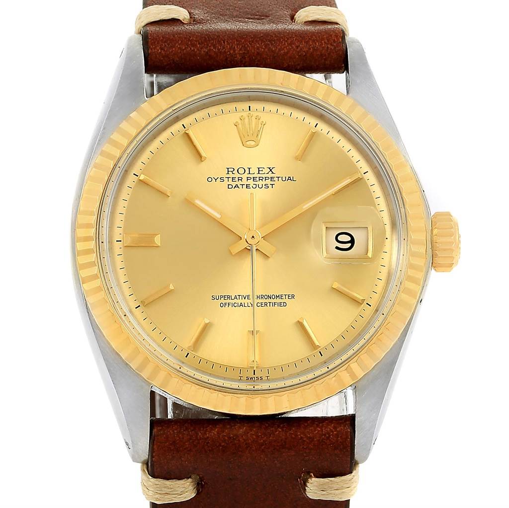 The image shows a front view of the Rolex Vintage Collection 1601 Men's Steel and Gold (two tone) Champagne Dial 1601 Men's Steel and Gold (two tone) Champagne Dial Oyster Perpetual Datejust with a gold dial and brown leather strap.