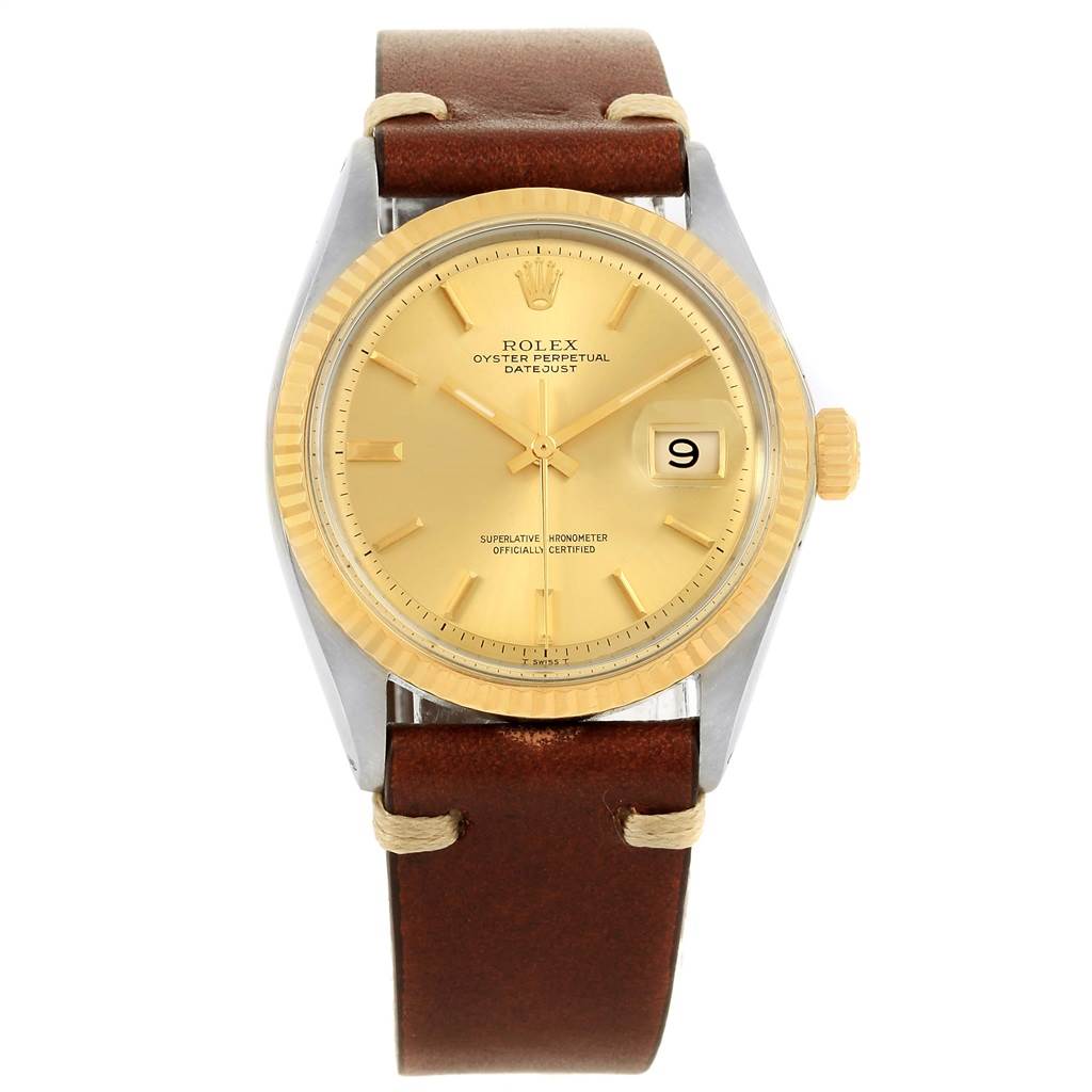The Rolex Vintage Collection 1601 Men's Steel and Gold (two tone) Champagne Dial 1601 Men's Steel and Gold (two tone) Champagne Dial watch is shown from a front angle, displaying the face with a date window and a brown leather strap.