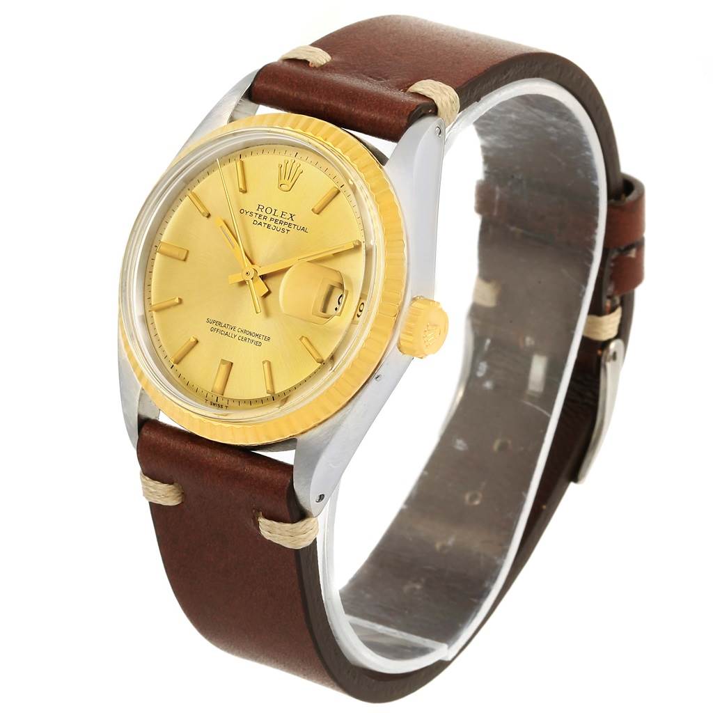 The Rolex Vintage Collection 1601 Men's Steel and Gold (two tone) Champagne Dial 1601 Men's Steel and Gold (two tone) Champagne Dial model watch is shown from an angled view highlighting the dial, case, bezel, crown, and leather strap.