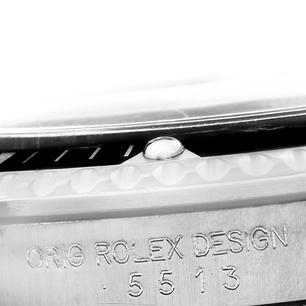This image shows a close-up angle of the bezel and engraved serial number of the Rolex Vintage Collection 5513 Men
s Stainless Steel Black Dial 5513 Men
s Stainless Steel Black Dial model 5513.